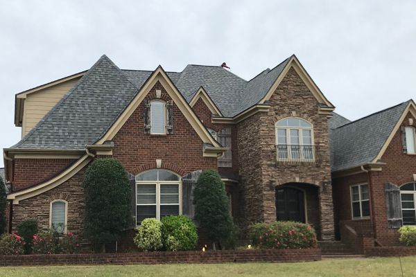 A large brick house with a lot of windows.